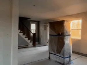 Renovated open area with staircase visible in interior renovation project.
