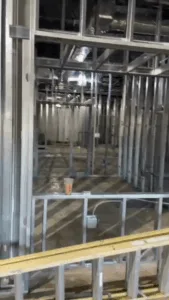 Metal stud framing installation displaying interconnected wall framing and open layout.